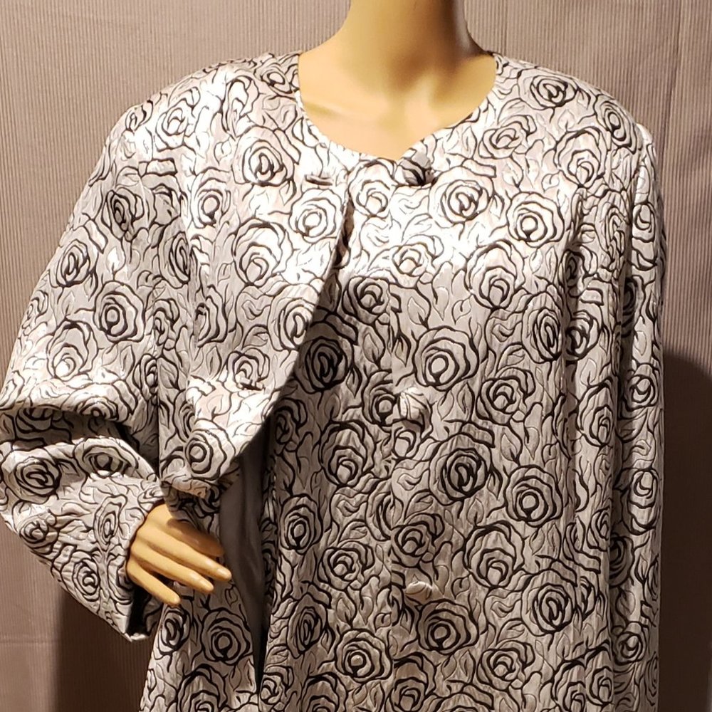 Gray long dress with matching long coat, coved with sunken black roses